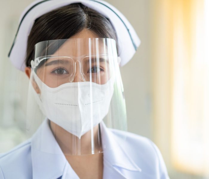 portrait-of-asian-nurse-in-protect-face-shield-KQAJX4X